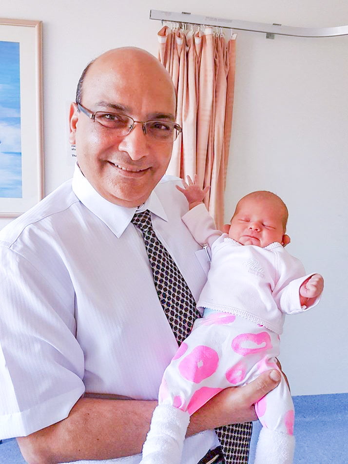 Dr Farag holding baby